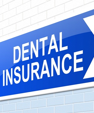 Dental insurance sign on brisk wall.