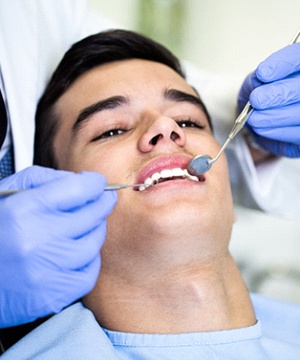 Male patient attending checkup with United Concordia dentist